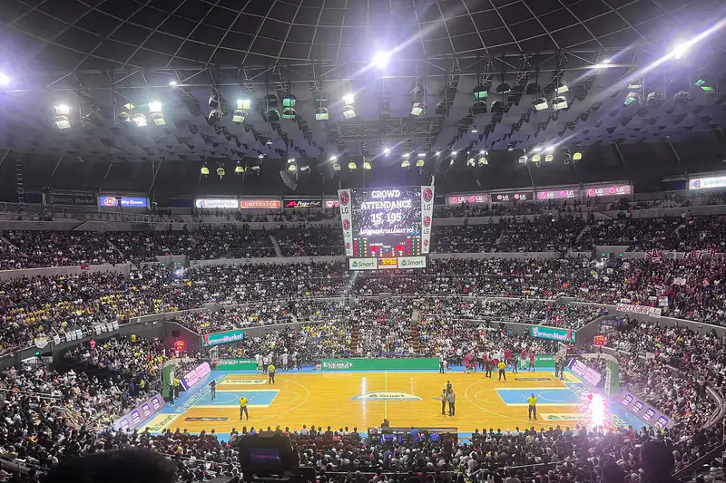 A packed arena full of fans watching a PBA Philippine Cup finals basketball game